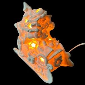 Santa Claus in Sleigh Lighted White Ceramic Glitter Holiday Decor.